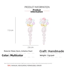Detail view of long pastel beaded tassel earrings with size measurement 7.3cm x 2.6cm
