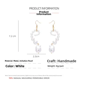 Detailed view of baroque pearl drop earrings with spiral design and 7.2cm length