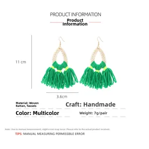 Detail view of handmade woven rattan tassel earrings with 11cm length measurement info