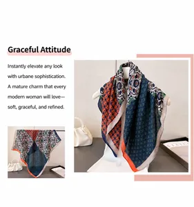 Détail d'un élégant foulard en soie à chevrons avec motifs floraux vintage et géométriques