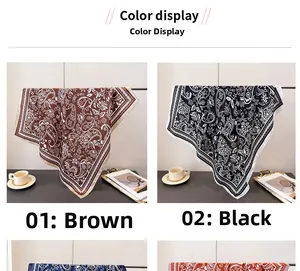 Detail of paisley silk scarves in brown and black with premium stitched edges