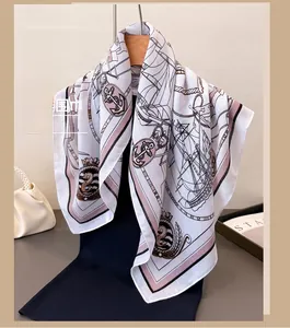 Detail of nautical print scarf with sailing ships and anchors on vintage silk-feel fabric