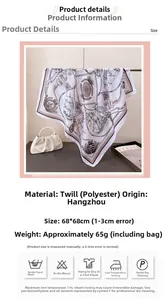 Detail of pink silk-like scarf featuring nautical prints and textured herringbone weave
