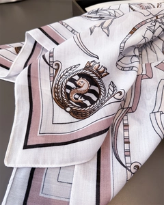 Detail of elegant cotton linen feel scarf with crown and seahorse heraldic pattern