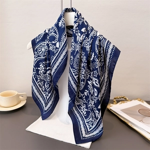 Navy blue paisley silk scarf for women featuring elegant white floral patterns