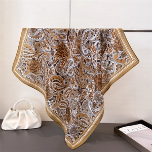 Elegant paisley and rose pattern square scarf in mustard yellow with silky texture