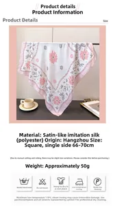 Detail eines Seidenschals mit Blumendruck, rosa Rand und weicher Satingewebe-Textur