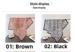 Detail view of brown and black paisley silk scarves with contrast piped edges