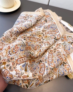 Close-up of elegant paisley pattern printed on vintage soft silk cotton scarf material