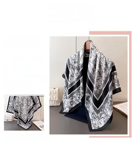 Detail of silk scarf featuring black and white ink bamboo prints and premium hemmed edges