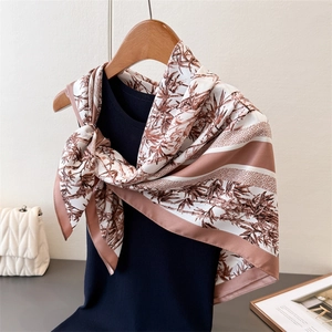 Retro bamboo print faux silk scarf displayed elegantly on a dark vest and wooden hanger