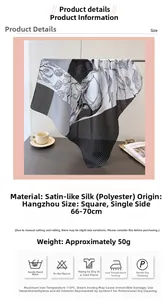 Close-up of elegant black and white botanical leaf print on a satin square scarf