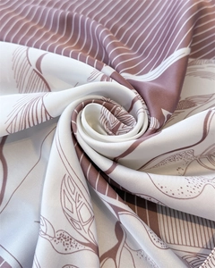 Detailed macro view of high-quality silk scarf fabric with elegant floral print