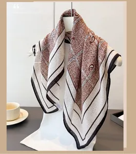 Close-up of brown paisley and geometric pattern on elegant lightweight cotton linen scarf