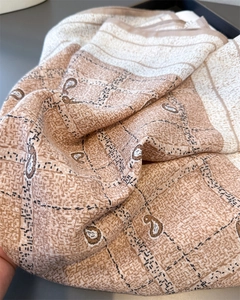 Detail shot of vintage paisley and plaid pattern on soft cotton linen blend scarf