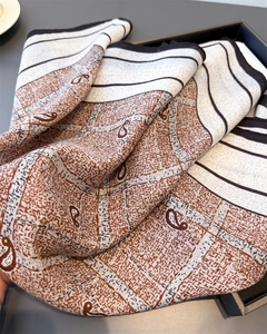 Macro shot of paisley and striped patterns on soft herringbone cotton-linen scarf
