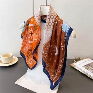 Detail of premium silk scarf with retro geometric paisley prints and glossy finish