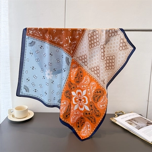 Fashionable paisley print silk square scarf in vibrant orange and blue for women