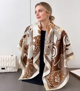 Detailed view of brown and beige floral satin scarf with elegant silk texture and drape