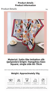 Detail showing elegant orange floral pattern on satin silk scarf with bold red border