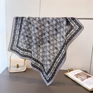 Detail of herringbone printed silk square scarf with vintage baroque floral patterns