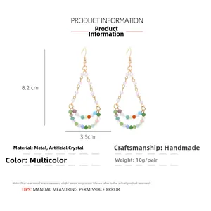 Detail of bohemian teardrop earrings with dimensions 8.2cm x 3.5cm and colorful beads