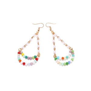 Bohemian teardrop earrings with multi-colored crystals and pearls on white background