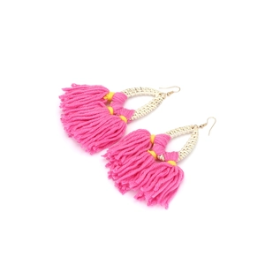 Detail of pink cotton tassels and cream woven teardrop base on bohemian style earrings