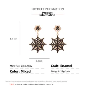 Detail view of gothic spider web earrings with dimensions 4.8cm by 3.1cm in gold and black