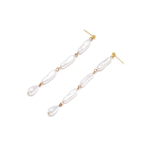 Elegant long baroque pearl drop earrings with golden tassels on a clean white background