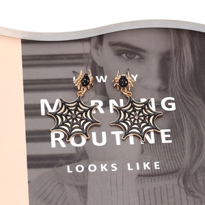 Gothic gold alloy spider and web drop earrings with black enamel for Halloween style