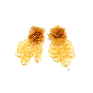 Close-up of yellow gauze flower petal earrings with imitation pearls and tassels