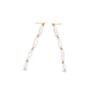 Elegant long baroque pearl tassel drop earrings with gold finish on a white background