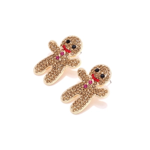 Vue macro de boucles d'oreilles bonhomme de pain d'épices avec strass colorés étincelants