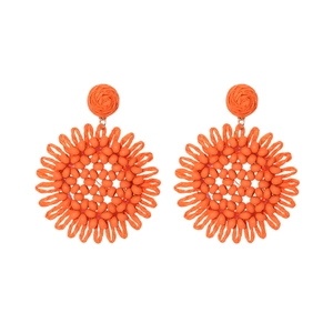 Handwoven orange raffia sunflower drop earrings in Bohemian style with beaded details