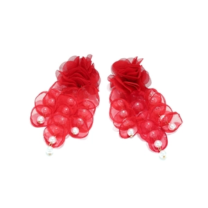Detailed close-up of handmade red mesh flower earrings with dangling faux pearls