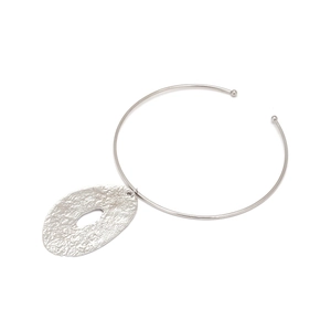 Detail of silver alloy collar necklace with hammered irregular oval hollow pendant
