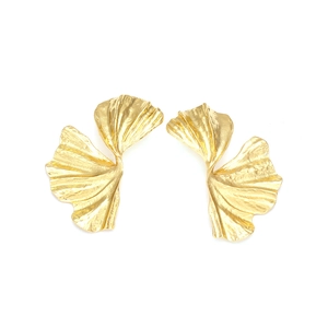 Detailed view of vintage gold ginkgo leaf earrings with textured metallic surface
