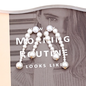 Baroque faux pearl beaded drop earrings with U-shaped design and gold metal accents