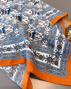 Detailed macro view of retro herringbone silk scarf fabric showing texture and pattern