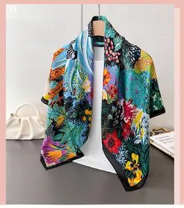 Detail of zebra print silk scarf with floral patterns on a wooden hanger with accessories