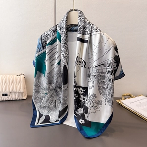 Detailed close-up of elegant zebra print silk scarf with floral and architectural patterns