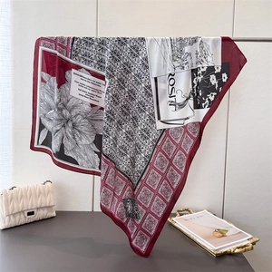 Zebra silk-like square scarf featuring floral prints and geometric patterns on display