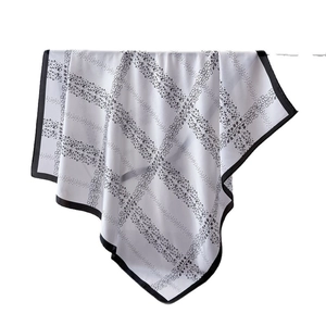 Elegant floral print silk scarf for women featuring black polka dots on white fabric