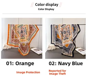 Detail of vintage paisley silk-feel scarf showing orange and navy floral patterns