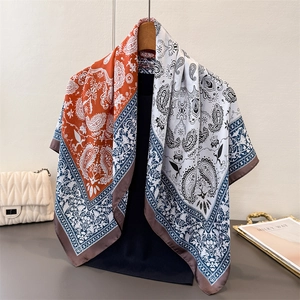 Detail of paisley print satin scarf showing elegant drape and rolled edge finish