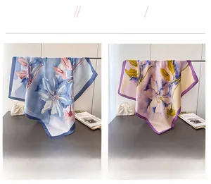 Detail showing two floral silk-feel square scarves in blue and purple elegant patterns