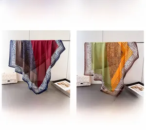 Detailed color display of paisley satin scarves in burgundy-blue and olive-green options