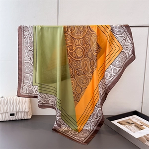 Elegant large satin square scarf with paisley print in green, orange and brown tones