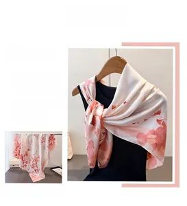 Close-up of ink style lotus print on premium white faux silk scarf for elegant draping